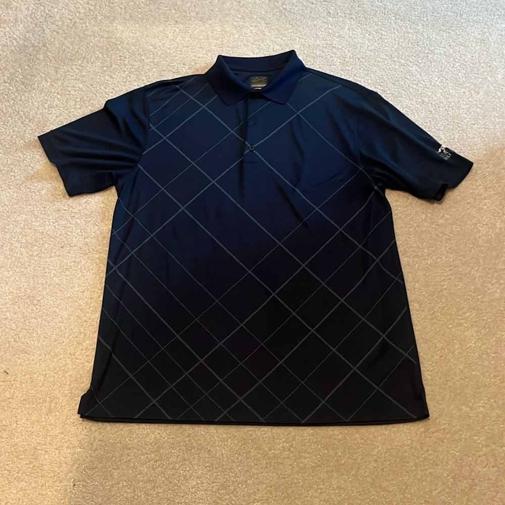Men’s Greg Norman polo. Lely Mustang Golf Club embroidered on left sleeve.